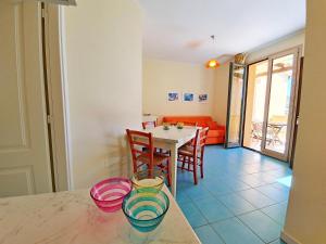 a kitchen and dining room with a table and chairs at La Pergola al Cavo 107 in Cavo