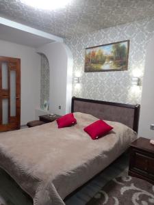 Ένα ή περισσότερα κρεβάτια σε δωμάτιο στο Котедж Тиша