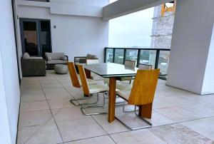 a dining room with a table and chairs at Private Terrace in Luxury 3BR Condo in Brickell in Miami
