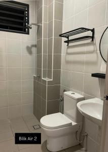 a bathroom with a shower with a toilet and a sink at DNikayla Homestay in Jitra +23 photos
