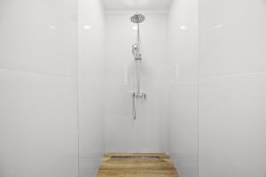 a shower in a room with a white wall at Old Tower Center Apartment 2 in Pula +25 photos