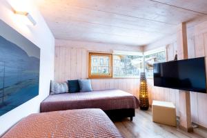 Postel nebo postele na pokoji v ubytování Designferienhaus Altenmarkt Zauchensee