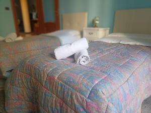 A bed or beds in a room at La casa sul mare-Savona
