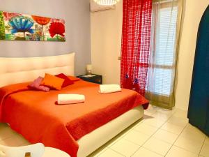 Ένα ή περισσότερα κρεβάτια σε δωμάτιο στο Apartments Di Salvo +75 φωτογραφίες