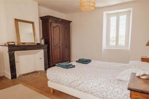 En eller flere senge i et værelse på Rouède - Maison de caractère au pied des Pyrénées