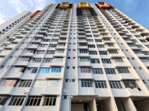 a tall white building with windows at BW White Falim Ipoh in Ipoh