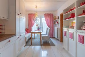 a kitchen with a table and a dining room at Emily´s Traum in Husum