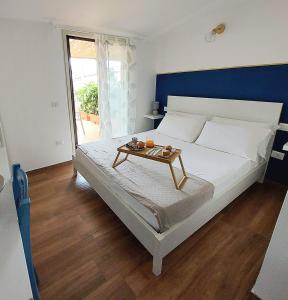 Postel nebo postele na pokoji v ubytování Casa sulla Punta