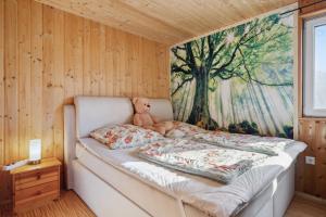 Postel nebo postele na pokoji v ubytování Ferienhaus Zeulenrodaer Meer