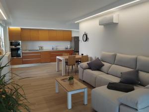 a living room with a couch and a table at La Barbacana in Laguardia