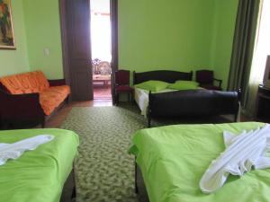 Postel nebo postele na pokoji v ubytování Guest House Nona