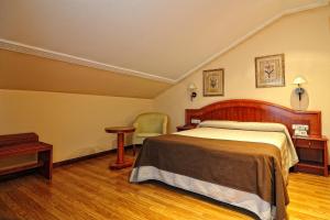 Postel nebo postele na pokoji v ubytování Hotel Alisi