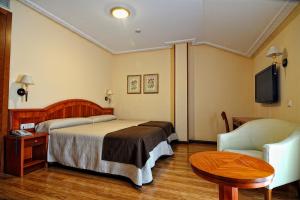 Postel nebo postele na pokoji v ubytování Hotel Alisi