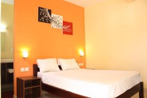 Postel nebo postele na pokoji v ubytování Le cactus guesthouse + 5 fotografií