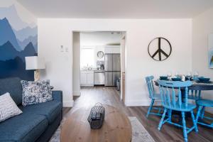 a living room with a couch and a table at "Hike" at Hills Meaford, Pet Friendly, 2BD Suite in Meaford +17 photos