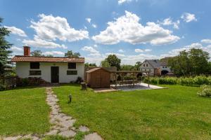 a view of a yard with a house at Cozy cottage Geltschberg Nr. 1 in Liběšice +25 photos