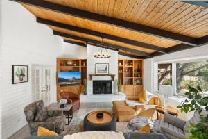 a living room with a couch and a fireplace at Centrally Located with Pool, Hot Tub, & Firepit in Sedona