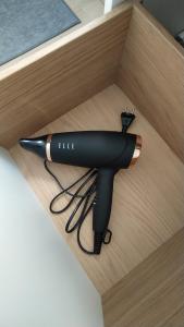 a hair dryer sitting in a box at Bois de rose in Theux