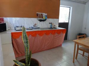 a kitchen with a sink and a counter top at Calme et Claire in Mt Bois Noir