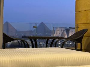 Voodi või voodid majutusasutuse Asia Pyramids View toas