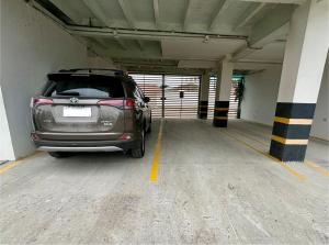 a car is parked in a parking garage at Las Casitas - Milina in Salinas