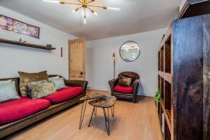 a living room with a couch and a table at Pet-friendly flat w/ garden patio & smart tv in Bristol