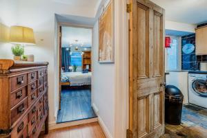a hallway with a door leading to a bedroom at Pet-friendly flat w/ garden patio & smart tv in Bristol