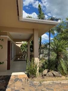 a porch of a house with a balcony at Casa do vivi 1 in Tramandaí