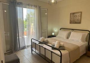 Ένα ή περισσότερα κρεβάτια σε δωμάτιο στο Villa Vaios +8 φωτογραφίες