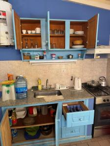 a kitchen with a sink and a counter top at La rosadita in San Clemente del Tuyú