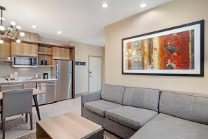 a living room with a couch and a kitchen at Best Western Executive Residency IH-37 Corpus Christi in Corpus Christi