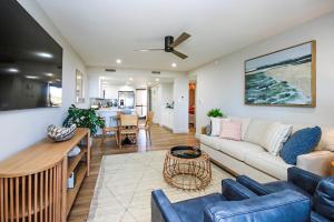 a living room with a couch and a table at Stylish 2BR Sanibel Condo With Amazing Beach Views 5C2 in Sanibel