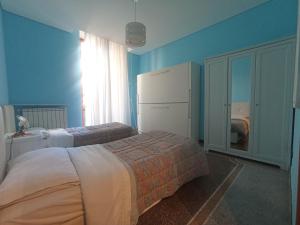 A bed or beds in a room at La casa sul mare-Savona