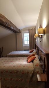 Postel nebo postele na pokoji v ubytování Hotel Eskualduna Chez Katina
