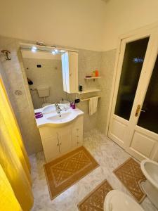 a bathroom with a sink and a mirror at Il Ronchetto in Sorso