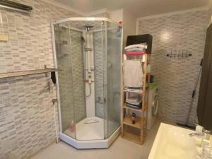 a shower with a glass door in a bathroom at 200 M TIL ALT to everything in Egersund +20 photos