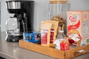 a wooden tray filled with food on a counter at Decadent Luxury - Covington Condo in Covington