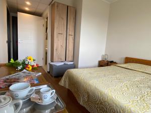 Postel nebo postele na pokoji v ubytování Hotel Ristorante SASSO