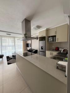 a kitchen with a large counter top in a room at 1 Bedroom Marina Bay Apartment 7 in Durban