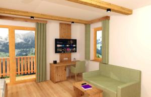A television and/or entertainment centre at Berggasthof - Pension Lahnerhof