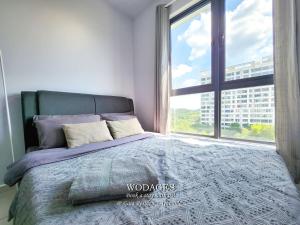 Postel nebo postele na pokoji v ubytování Gaia Residence at Gamuda Gardens - Pool View - Skyline Luge by Wodages + 21 fotografií