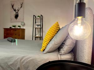 a bedroom with a bed with a corn pillow at The Red Door House in London