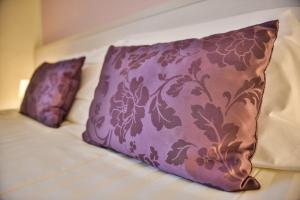 Postel nebo postele na pokoji v ubytování Hotel Bella Firenze