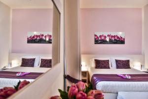 Een bed of bedden in een kamer bij Hotel Bella Firenze