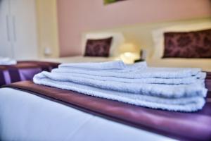 Postel nebo postele na pokoji v ubytování Hotel Bella Firenze