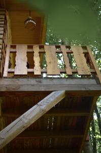 a wooden deck on top of a building at Treehouse Velké Losiny in Velké Losiny