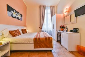 Postel nebo postele na pokoji v ubytování Hotel Bella Firenze
