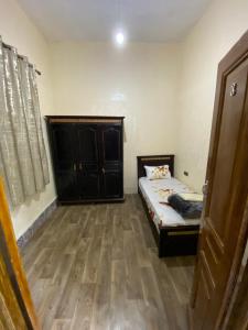 a bedroom with a bed and a wooden floor at Private Room in Kasbah - Old Medina 1 in Tangier