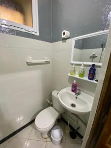 a bathroom with a toilet and a sink at Private Room in Kasbah - Old Medina 1 in Tangier