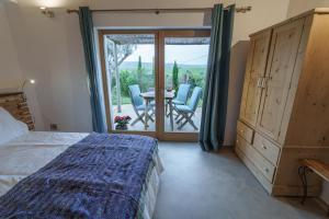 a bedroom with a bed and a table and chairs at Vale D Sancho Eco Turismo in Aljezur +73 photos